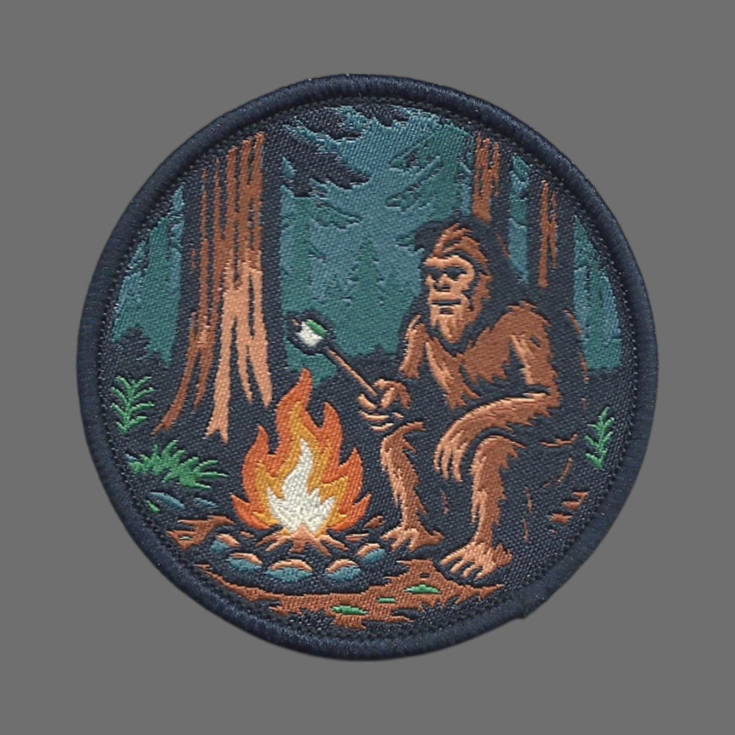 Bigfoot Campfire Roasting Marshmallow in the Woods Patch – Woven Iron On - 10613
